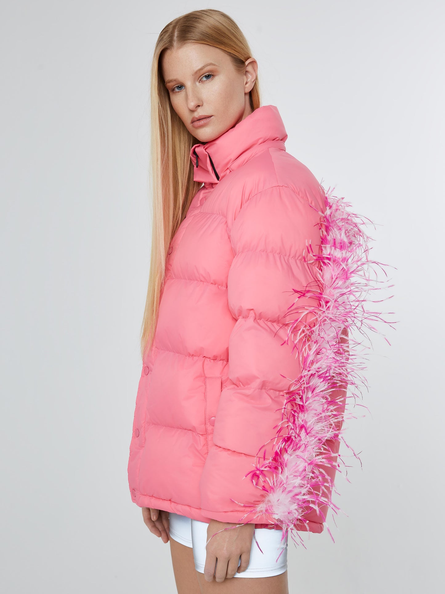 Pink puffer jacket with pink and white feathers