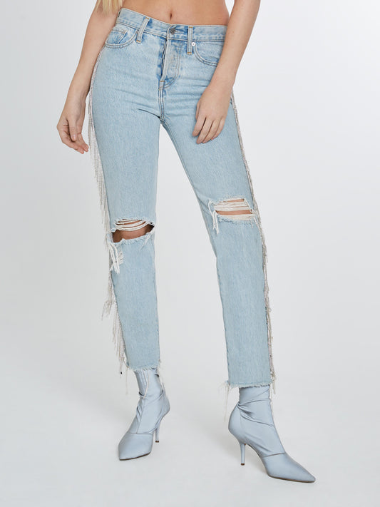 Light denim jeans with crystal fringe