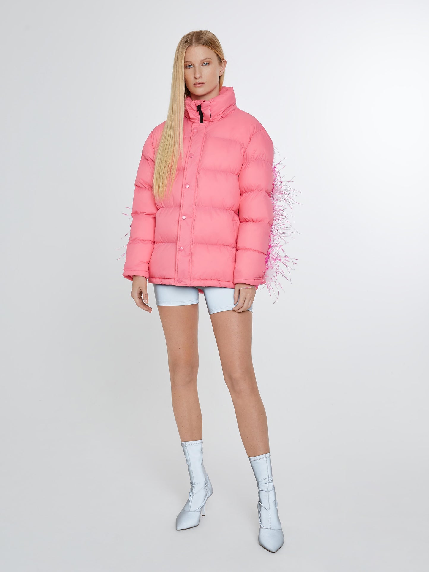 Pink puffer jacket with pink and white feathers