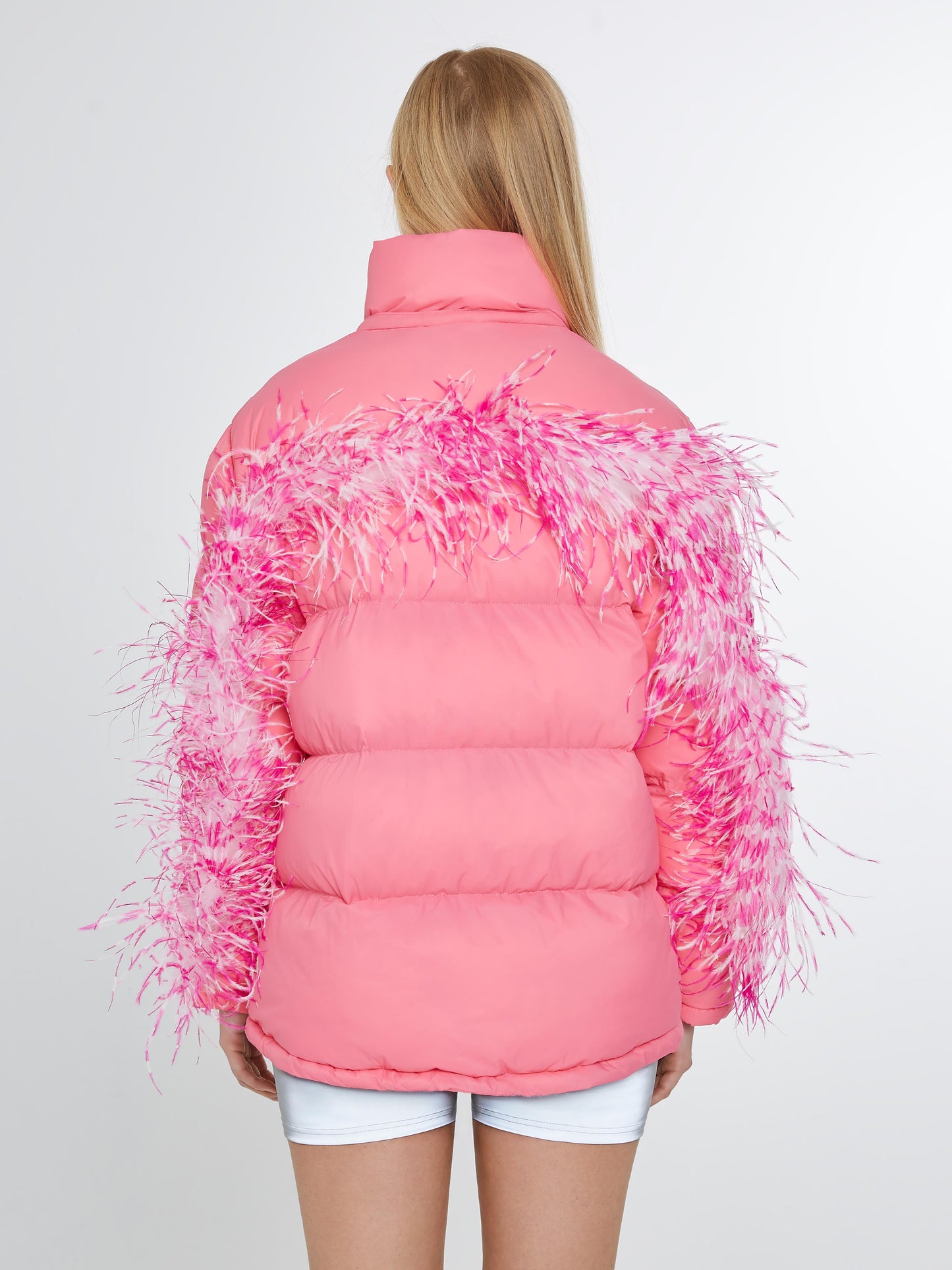 Pink puffer jacket with pink and white feathers